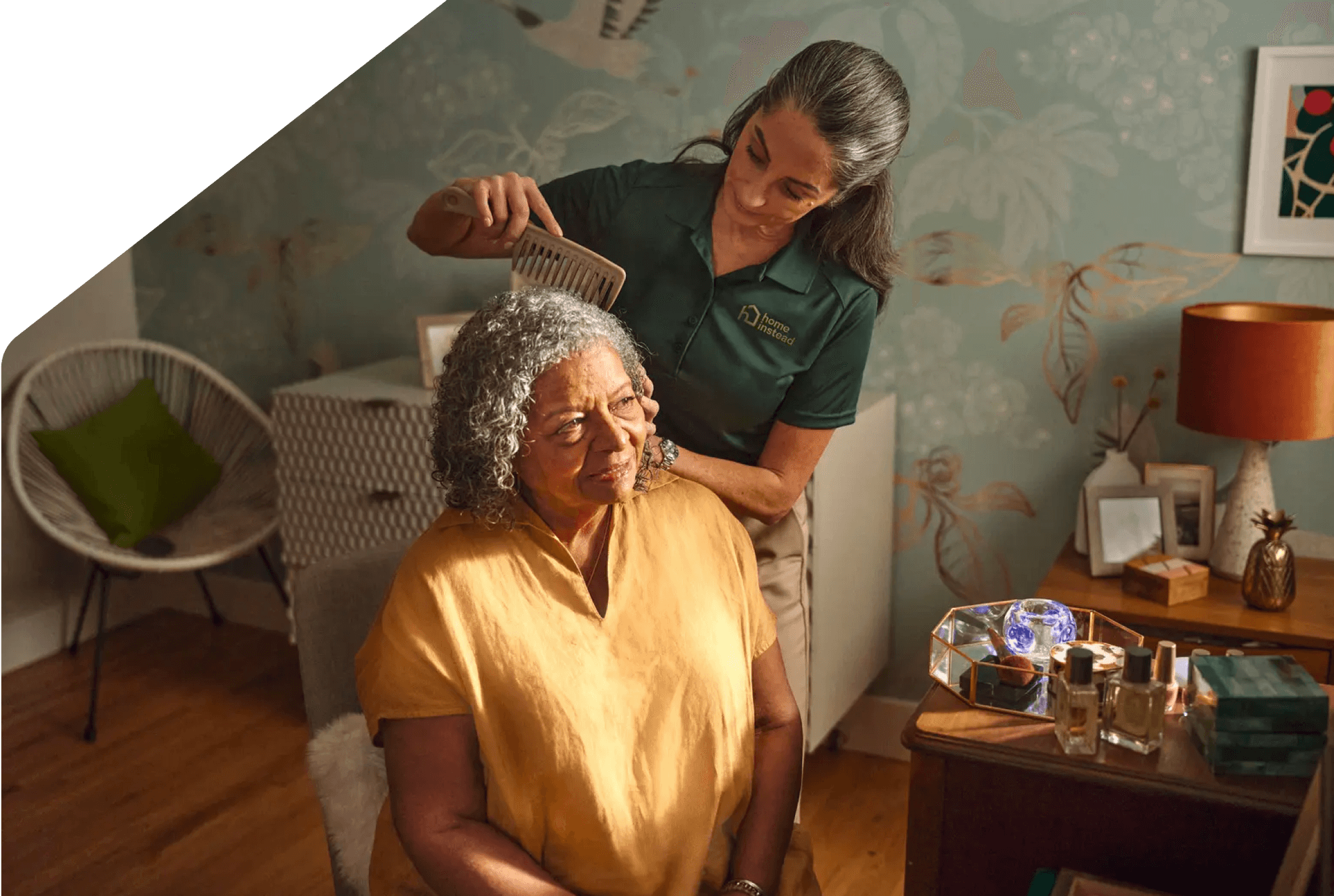 A Care Pro providing personal care to an aging adult.