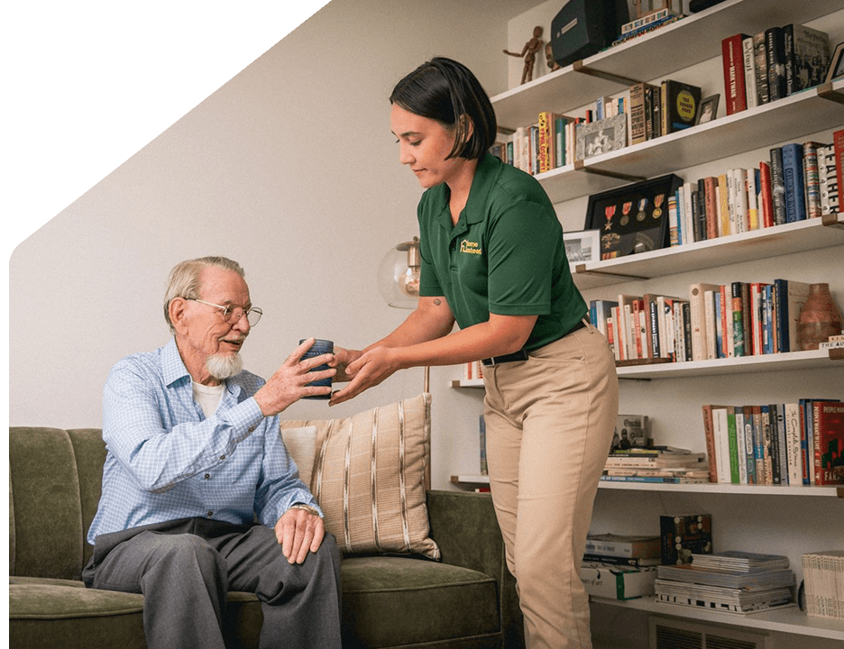 A Home Instead Care Pro with an adult.