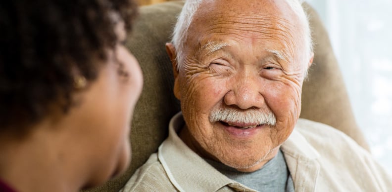 specially-trained-alzheimers-caregiver-smiles-with-senior.jpg