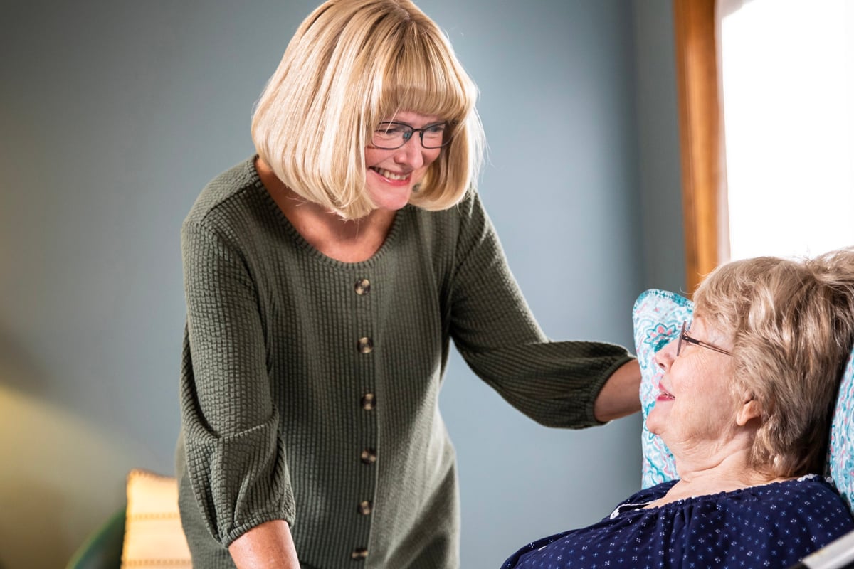 Woman caregiver smiling