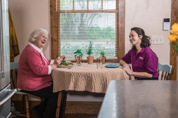 Care Professional Dementia Care Client Sitting at a Table