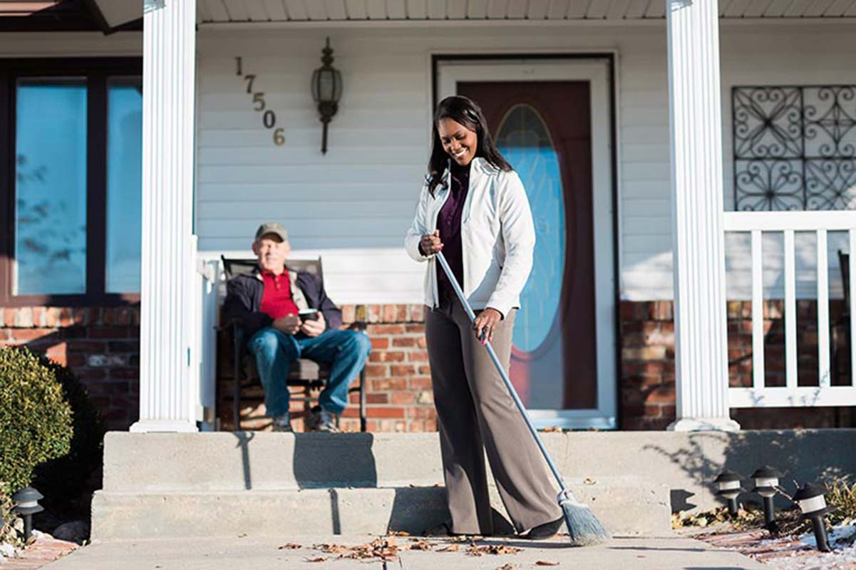 Caregiver helping a senior at his home