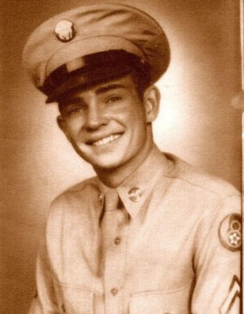 old photo of a soldier smiling in his dress uniform