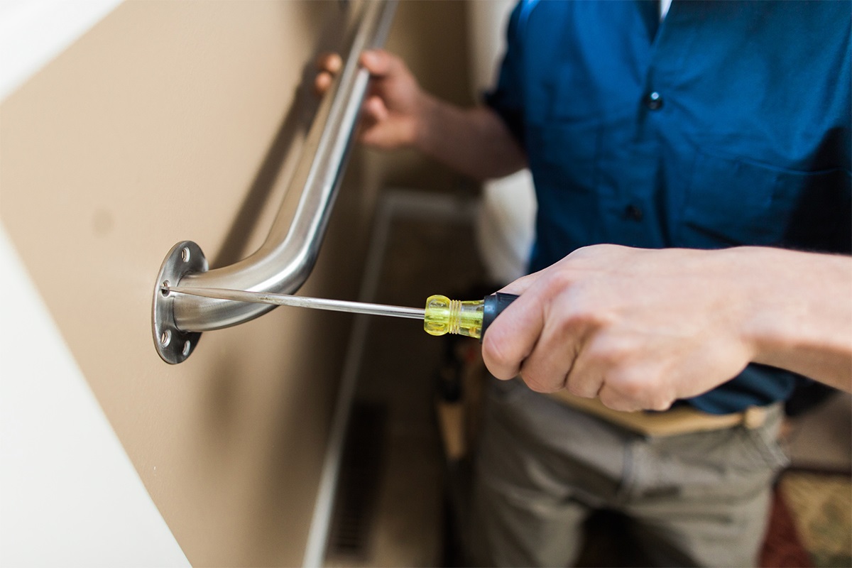 INstalling a senior safely grab bar on the wall