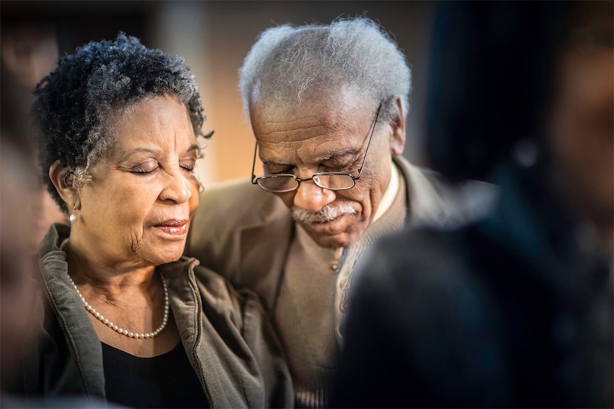 Two seniors praying