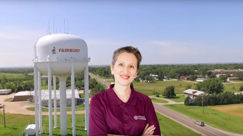 Home Instead caregiver with Fairbury Nebraska in the background