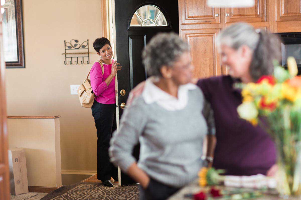 Family caregiver can have some time for herself as Home Instead caregiver takes over.