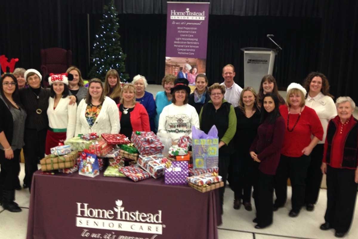 Home Instead Senior Care hosts wrap party to prepare gifts for distribution to isolated seniors through the Be a Santa to a Senior program.