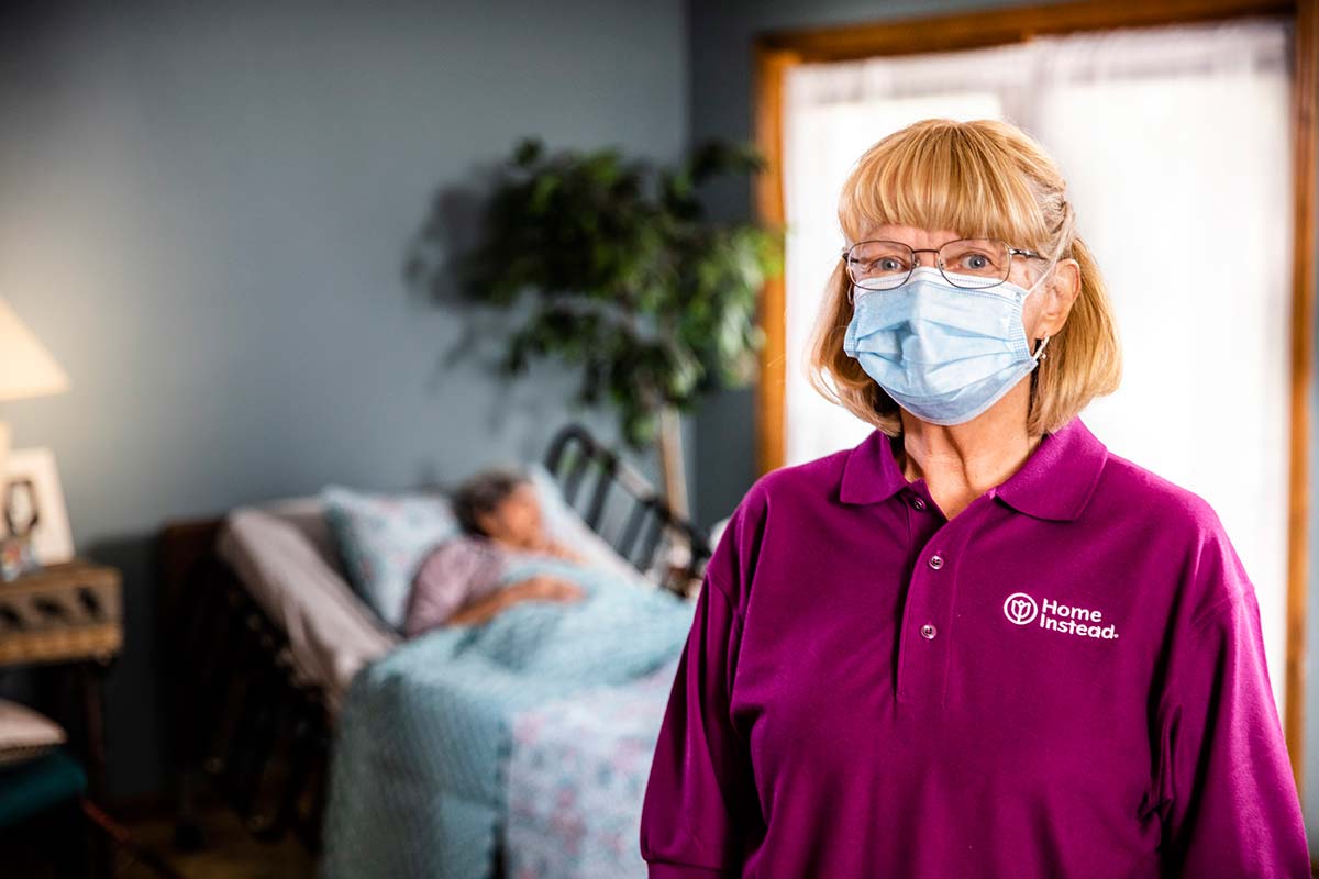 A Home Instead CAREGiver makes sure the hospice patient is comfortable