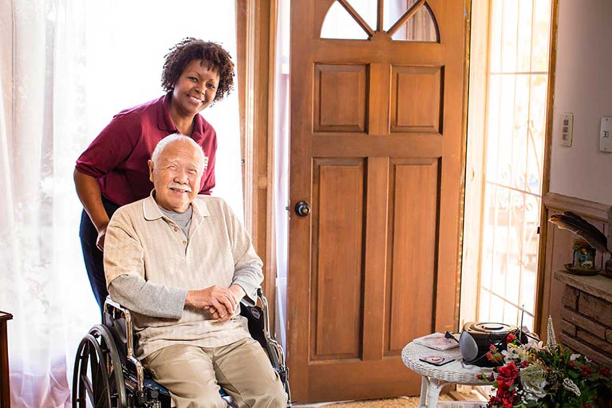 Caregiver helping a senior in a wheelchair