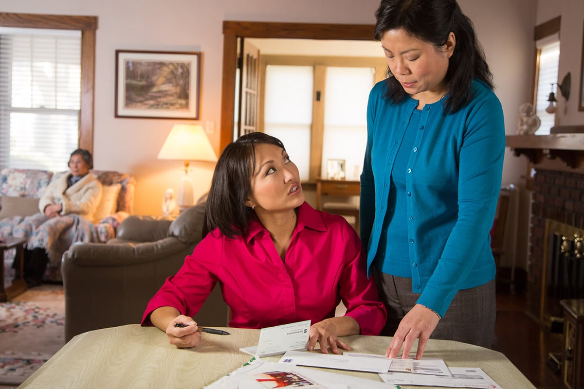 Mother and daughter talking about finances