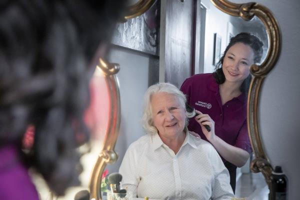 Care Professional Brushing Alzheimer's and Dementia Care Senior's Hair.jpg