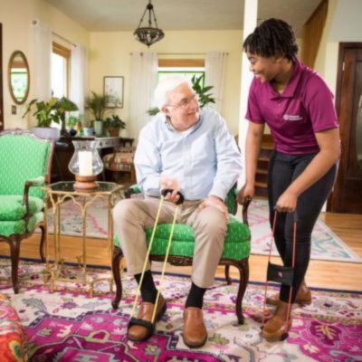 home instead caregiver assists senior client transition to home care