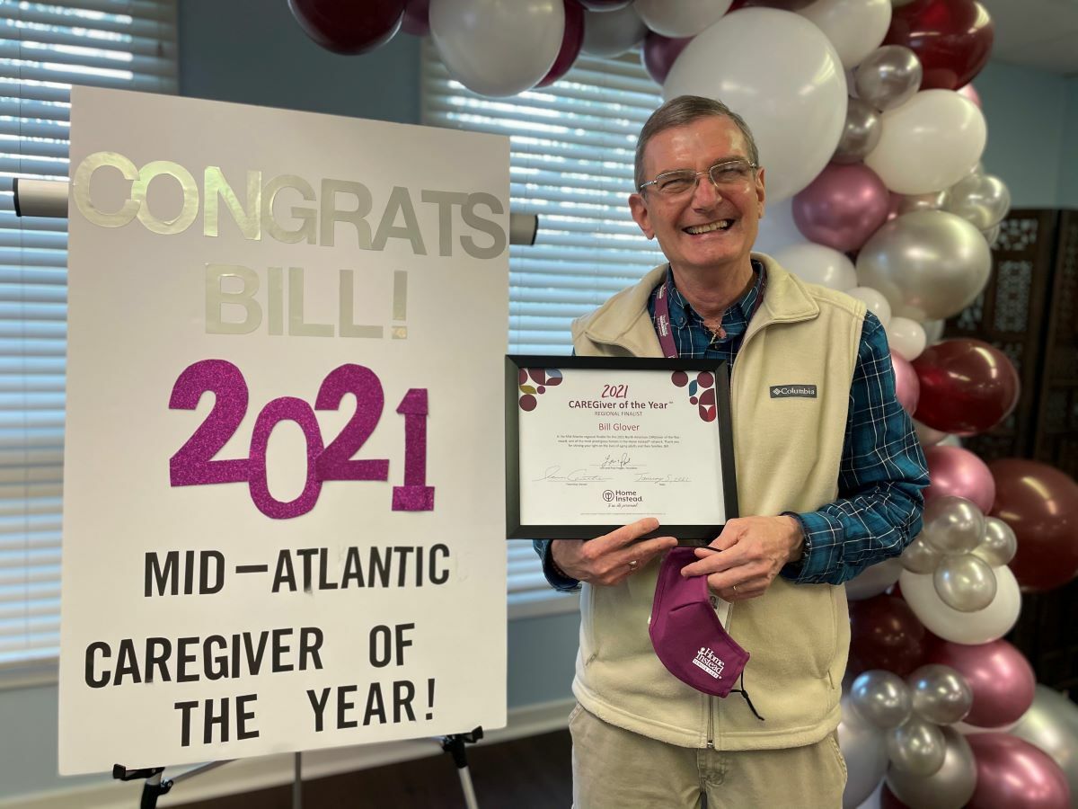 Home Instead Caregiver Bill Glover receives the 2021 Mid-Atlantic Caregiver of the Year award.