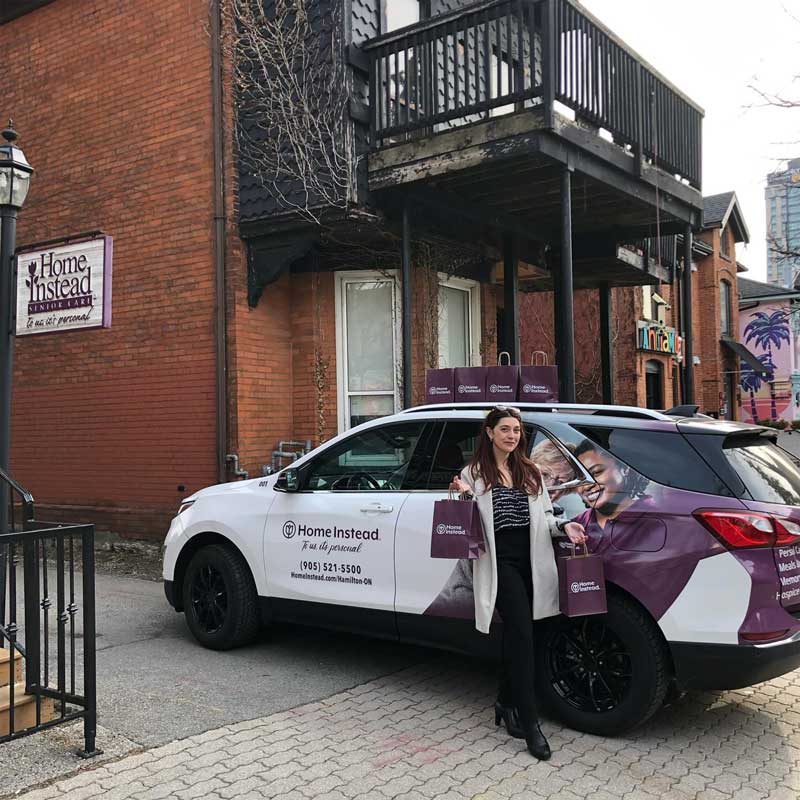 Amanda distributing care packages to local Social Workers