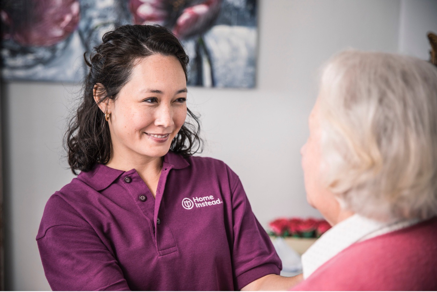 Caregiver Smiling at an Alzheimer's Client