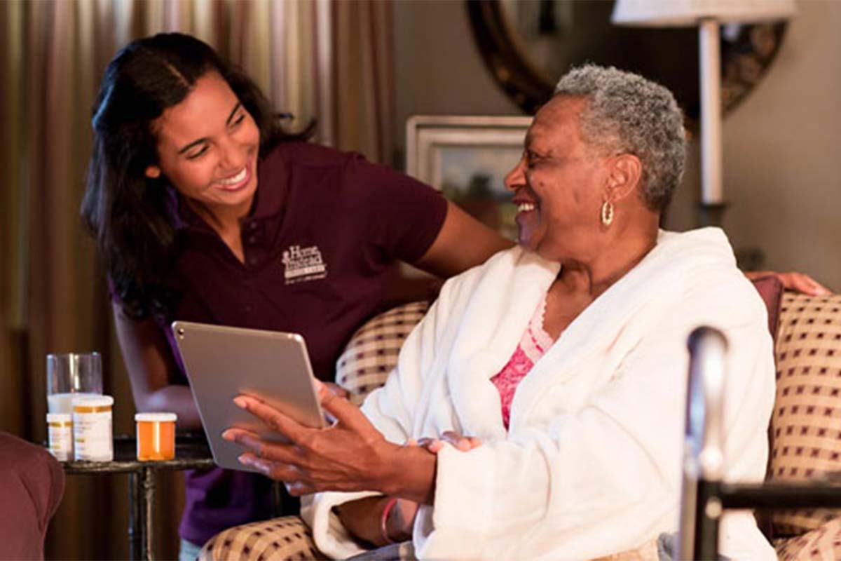 Senior and Caregiver enjoying safe browsing on the Internet