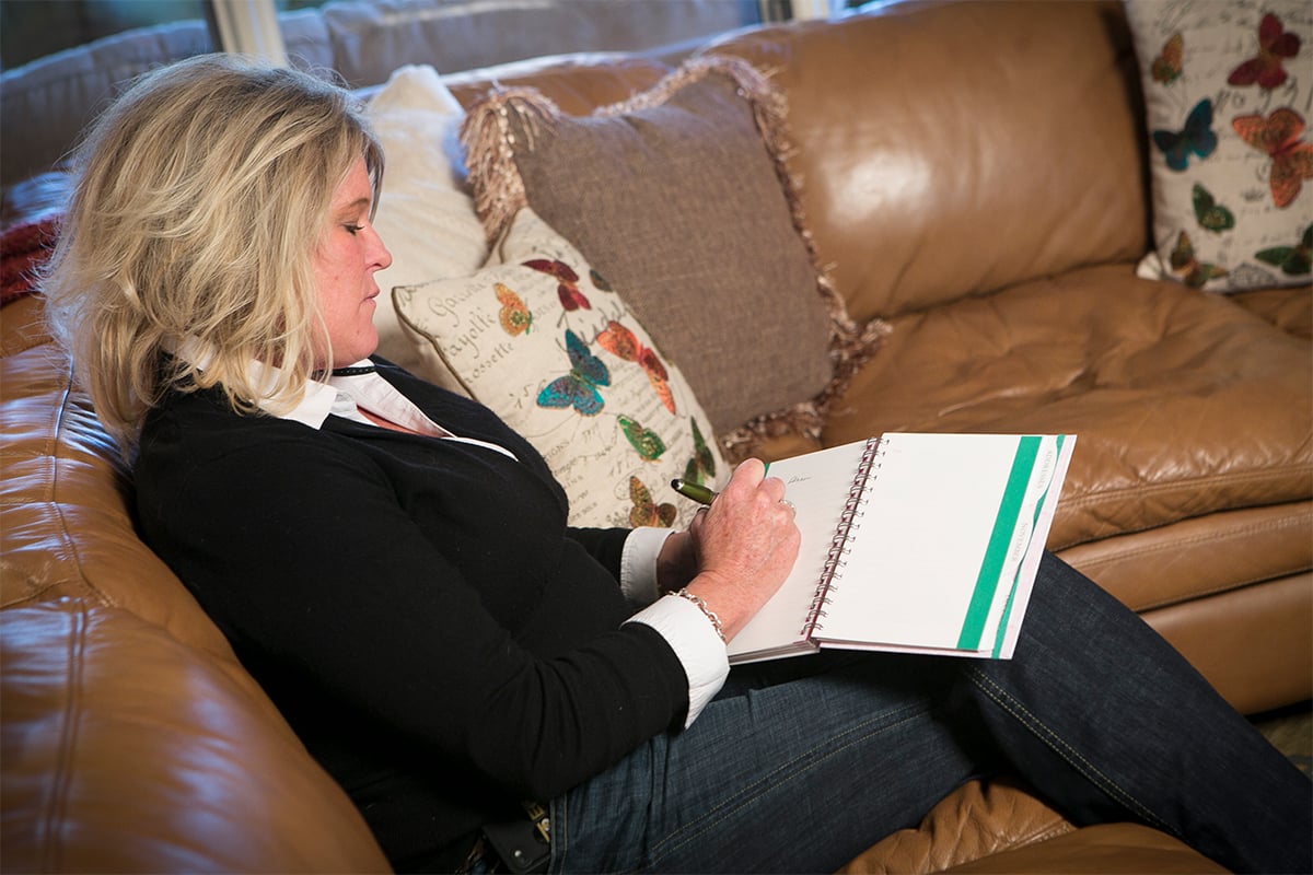 Family Caregiver taking notes