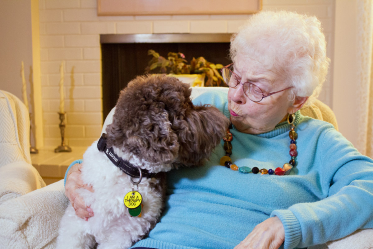 Home Instead senior with service dog